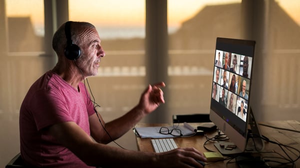 Man on computer conducts a digital Quarterly Business Reviews (QBRs) meeting