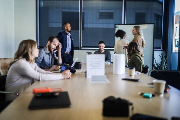 A Business Review meeting in progress with a whiteboard